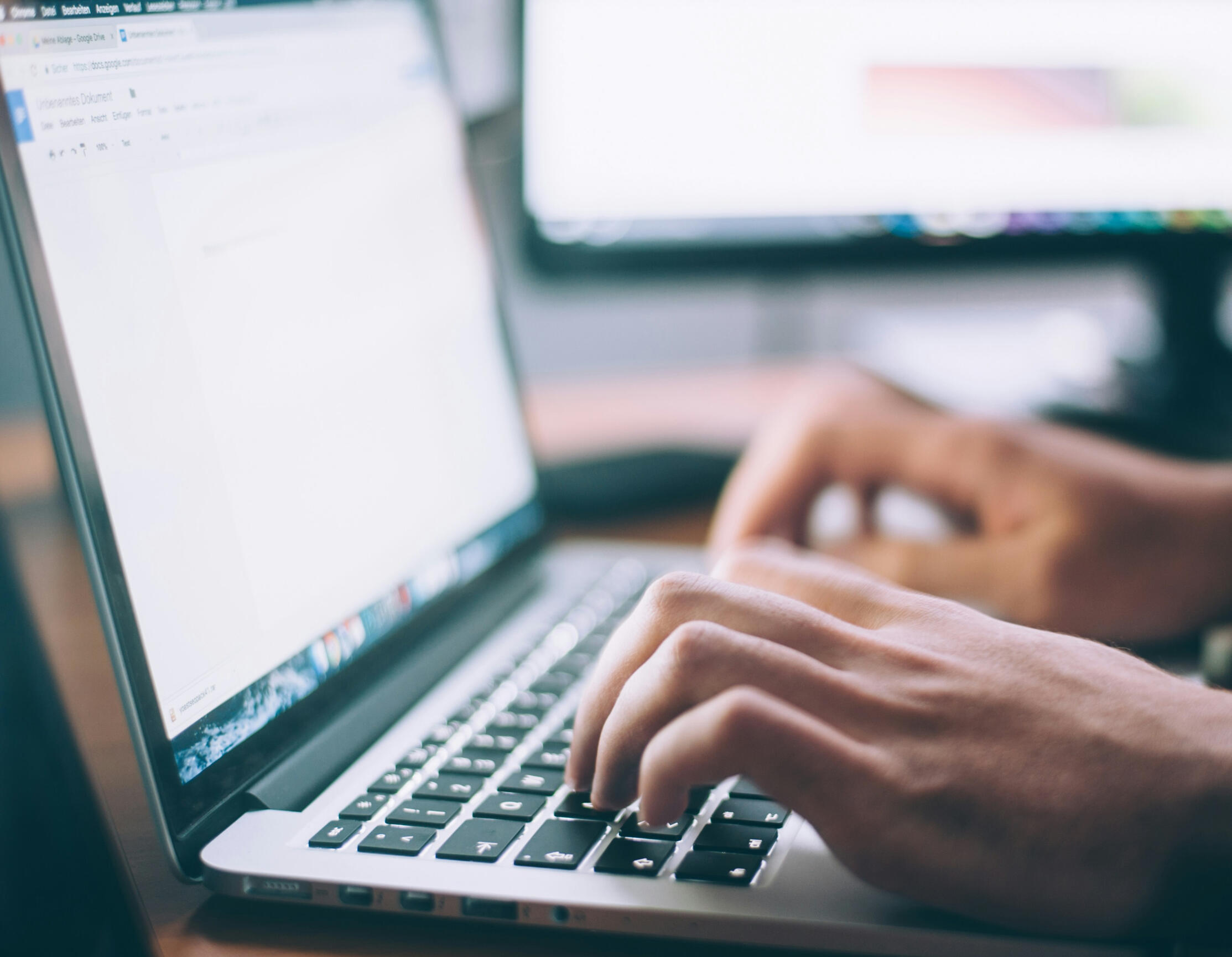 Data Analyst man typing computer